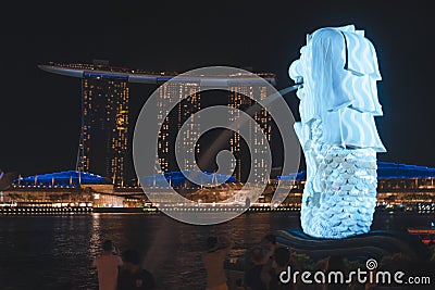 The Merlion overlooking Marina Bay Sands during Singapore iLight 2019 Editorial Stock Photo
